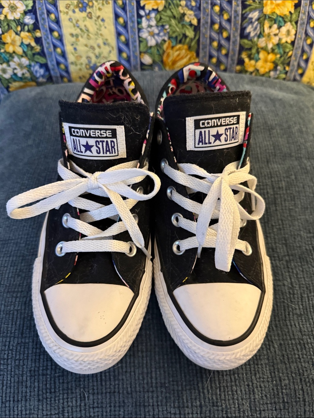 Converse Black Low-Top Sneakers with White Accents and Colorful Lining